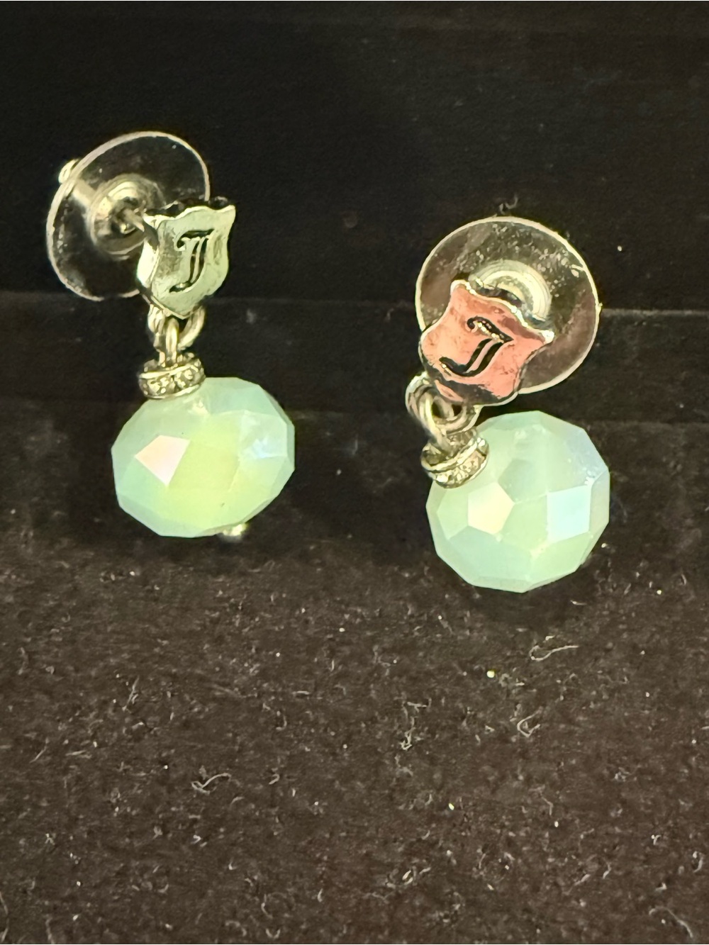 Juicy Couture silver color with light blue beads earrings.